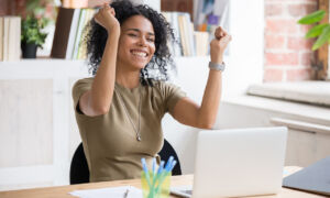 office lady cheering about programmatic advertising