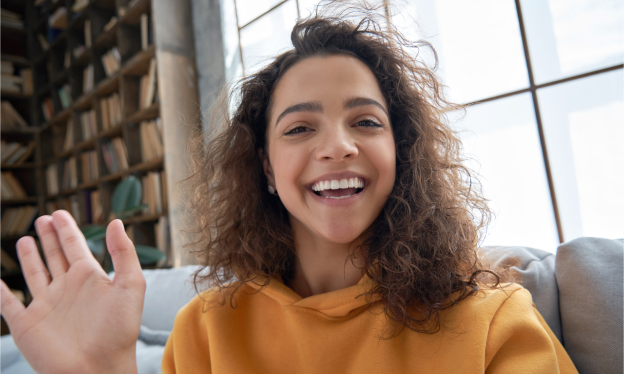 youtuber smiling and waving to the camera