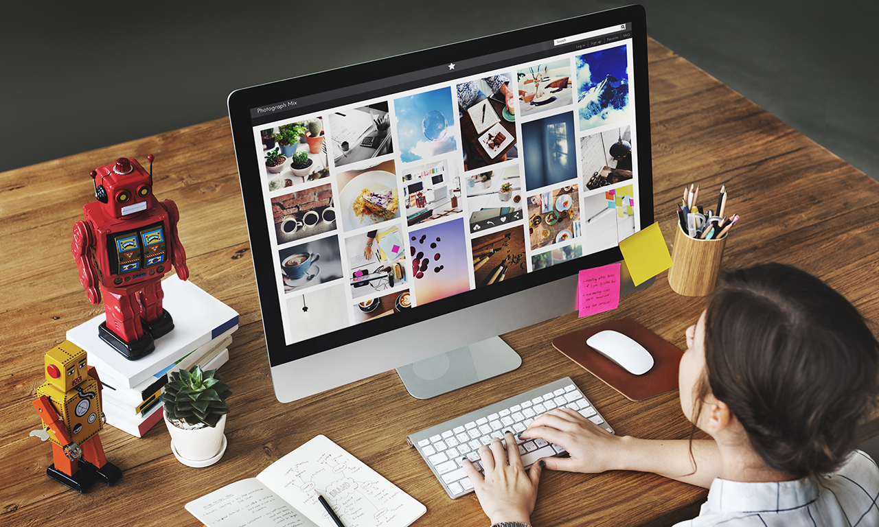 girl looking for ecommerce stock photos on a website