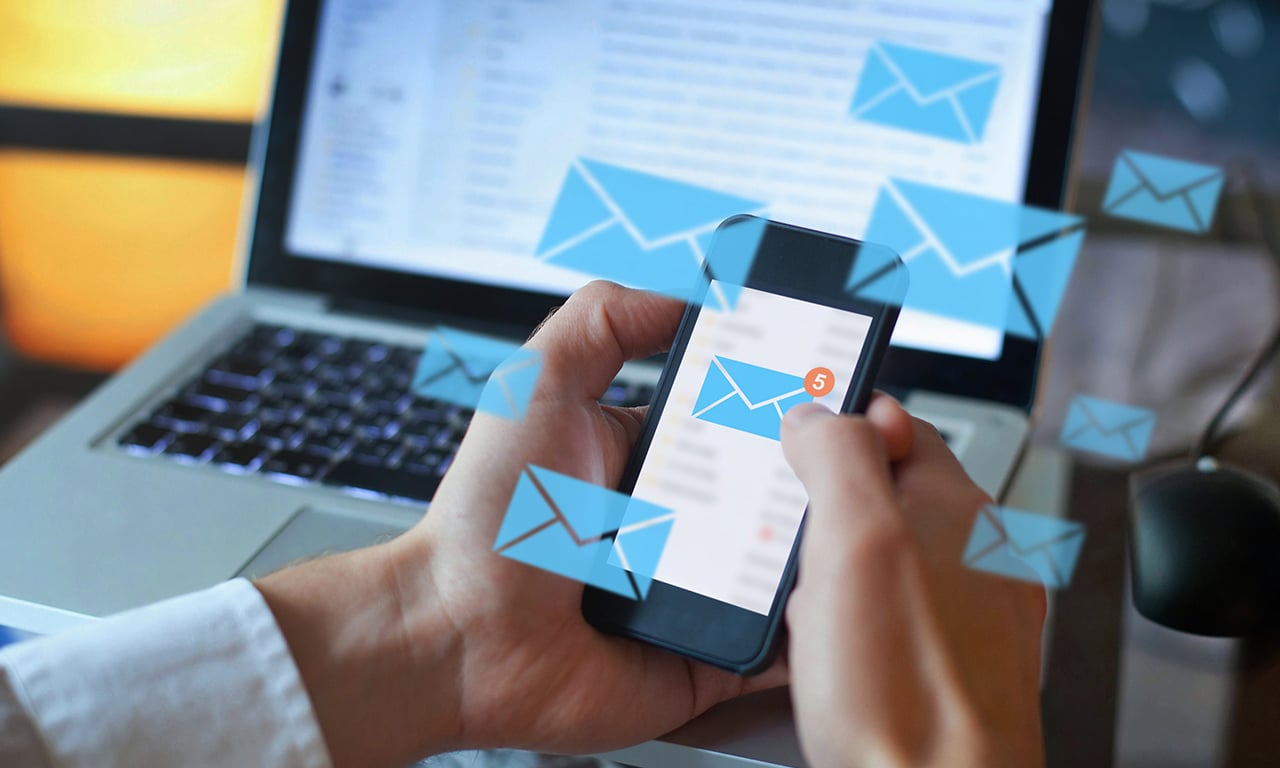 phone and holograms with email icons