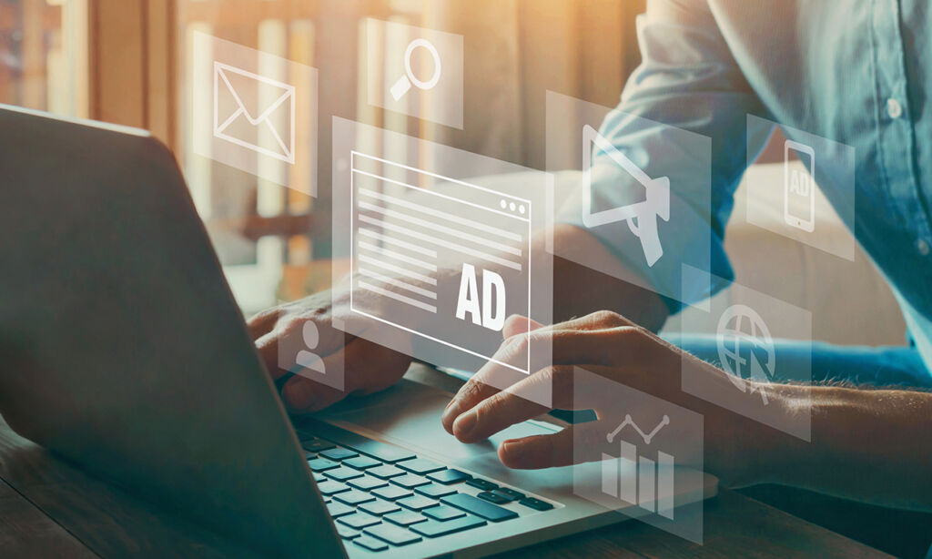 working on marketing and ads on laptop